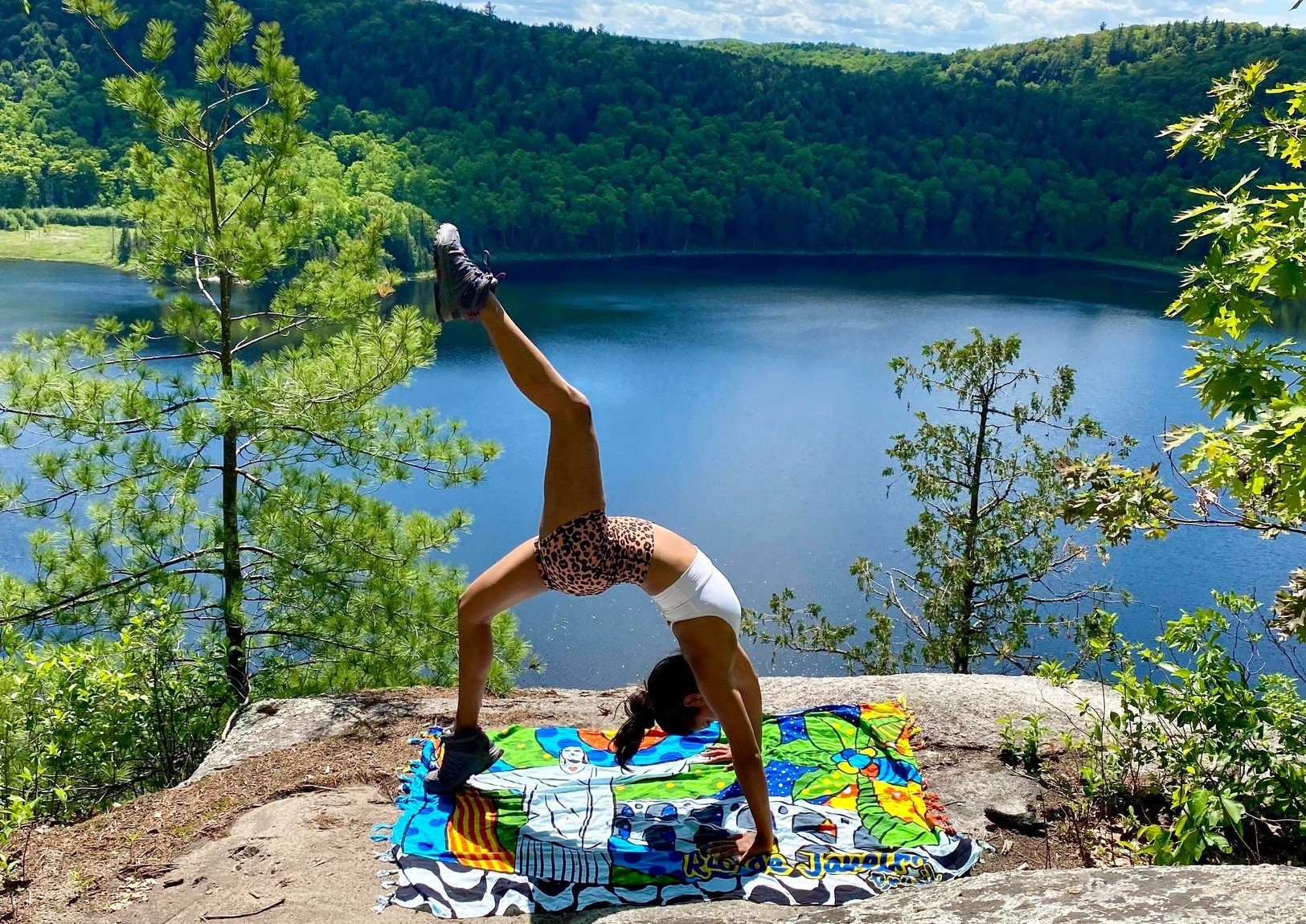 woman doing yoga bridge in nature