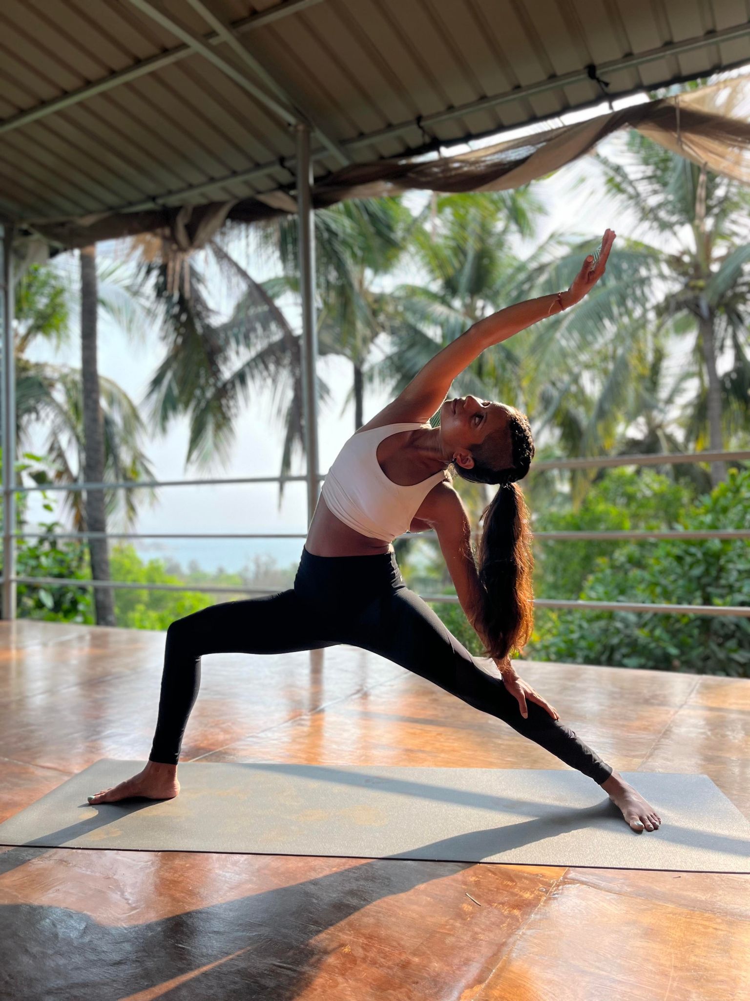 woman doing yoga warrior pose